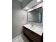 Bathroom with modern vanity, updated fixtures, and a large mirror at 72 Beverly Dr, Durham, NC 27707