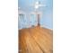 A large bedroom featuring hardwood floors, multiple closets, and neutral wall paint at 72 Beverly Dr, Durham, NC 27707