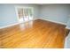 Empty bedroom with hardwood floors and sliding doors leading to a deck at 72 Beverly Dr, Durham, NC 27707