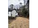 Home's exterior with deck and wooded area at 72 Beverly Dr, Durham, NC 27707