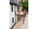 A view of the exterior of the house with a backyard patio area and wooden deck, creating an inviting outdoor space at 72 Beverly Dr, Durham, NC 27707