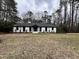 Front view of a renovated white ranch house with black accents at 72 Beverly Dr, Durham, NC 27707