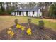 Picture of the home and yard including greenery, newly installed landscaping, and a brick walkway at 72 Beverly Dr, Durham, NC 27707