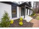 Exterior view of home including a freshly landscaped yard and a welcoming entry at 72 Beverly Dr, Durham, NC 27707