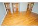 Open floor plan with hardwood floors and neutral paint, connecting multiple rooms at 72 Beverly Dr, Durham, NC 27707