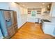 Bright kitchen features stainless steel appliances, white cabinets, and granite countertops at 72 Beverly Dr, Durham, NC 27707