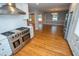 Modern kitchen with stainless steel appliances and stylish range and hood vent at 72 Beverly Dr, Durham, NC 27707