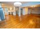 Open kitchen and living area with hardwood floors, stainless appliances, and a large island at 72 Beverly Dr, Durham, NC 27707