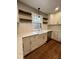 White shaker cabinets, farmhouse sink, quartz countertops at 72 Beverly Dr, Durham, NC 27707