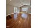 Bright living room with hardwood floors, large windows, and access to deck at 72 Beverly Dr, Durham, NC 27707
