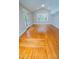 Bright living room with hardwood floors, vaulted ceilings, and access to the outdoors at 72 Beverly Dr, Durham, NC 27707