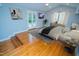 Well-lit main bedroom with hardwood floors and access to outdoor living space at 72 Beverly Dr, Durham, NC 27707