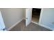 This attic access is accessible through a door and features carpet floors at 82 N Stagecoach Dr, Wendell, NC 27591