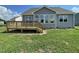A new home featuring an outdoor wooden deck in a spacious backyard with a view of the surroundings at 82 N Stagecoach Dr, Wendell, NC 27591