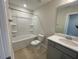 Bright bathroom featuring a tub shower, a toilet, and a vanity with a white countertop at 82 N Stagecoach Dr, Wendell, NC 27591