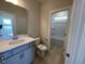 Modern bathroom with a large vanity, single sink, and a tub/shower combination at 82 N Stagecoach Dr, Wendell, NC 27591