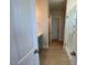 Well-lit bathroom featuring a glass shower, vanity with sink and wood-like flooring at 82 N Stagecoach Dr, Wendell, NC 27591
