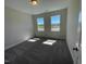 Bright bedroom with large windows and neutral carpet at 82 N Stagecoach Dr, Wendell, NC 27591