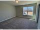 This is a cozy bedroom featuring plush carpet and a well-lit window at 82 N Stagecoach Dr, Wendell, NC 27591