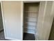 Bedroom closet featuring multiple adjustable wire shelves for storage and organization at 82 N Stagecoach Dr, Wendell, NC 27591