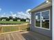 Back deck with wood railing overlooking a lawn in a residential neighborhood on a clear day at 82 N Stagecoach Dr, Wendell, NC 27591