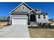 Charming single-Gathering home with stone accents and a two-car garage at 82 N Stagecoach Dr, Wendell, NC 27591