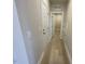 Hallway featuring wood-look tile flooring and access to other rooms at 82 N Stagecoach Dr, Wendell, NC 27591