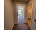Hallway view leading to a bedroom and a bathroom with carpet floors at 82 N Stagecoach Dr, Wendell, NC 27591