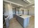 Kitchen island with stainless steel appliances at 82 N Stagecoach Dr, Wendell, NC 27591