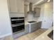 Bright kitchen with stainless steel appliances and tile backsplash at 82 N Stagecoach Dr, Wendell, NC 27591