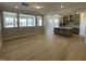 Open concept living room area with modern hardwood floors at 82 N Stagecoach Dr, Wendell, NC 27591