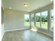 Sunlit living room with expansive windows offering scenic outdoor views at 82 N Stagecoach Dr, Wendell, NC 27591