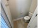Neutral powder room with a toilet, and wood-like flooring at 82 N Stagecoach Dr, Wendell, NC 27591