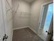 Spacious walk-in closet featuring carpet, shelving and a bathroom view at 82 N Stagecoach Dr, Wendell, NC 27591