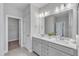 Elegant bathroom features a double vanity and a spacious closet at 8947 Kennebec Crossing Dr # 53, Angier, NC 27501