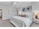 Main bedroom with a king-size bed, gray walls, and large windows at 8947 Kennebec Crossing Dr # 53, Angier, NC 27501