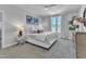Main bedroom with a king-size bed, gray walls, and large windows at 8947 Kennebec Crossing Dr # 53, Angier, NC 27501