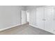 Spacious bedroom with gray walls, carpet, and double door closet at 8947 Kennebec Crossing Dr # 53, Angier, NC 27501