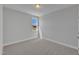 Bright bedroom with gray walls, neutral carpet, and a window with natural light at 8947 Kennebec Crossing Dr # 53, Angier, NC 27501
