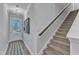 Bright entryway with staircase and neutral color palette at 8947 Kennebec Crossing Dr # 53, Angier, NC 27501