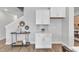 White kitchen cabinets and quartz countertops offer ample storage space at 8947 Kennebec Crossing Dr # 53, Angier, NC 27501