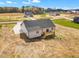 An aerial view of a home's rear exterior with a deck, new construction, and surrounding landscape at 9342 Turkey Way, Middlesex, NC 27557