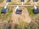 Birds-eye view of a new home in an undeveloped neighborhood with a lush tree line at 9342 Turkey Way, Middlesex, NC 27557
