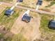 Aerial view of a neighborhood shows new homes with spacious lots, decks, and long concrete driveways at 9342 Turkey Way, Middlesex, NC 27557