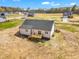 Aerial view featuring a spacious back deck perfect for enjoying outdoor living and entertaining at 9342 Turkey Way, Middlesex, NC 27557