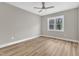 Serene bedroom featuring neutral walls, a ceiling fan, and a window with natural light at 9342 Turkey Way, Middlesex, NC 27557