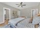 Bright bedroom with a ceiling fan and a view of the outdoors, creating a relaxing atmosphere at 9342 Turkey Way, Middlesex, NC 27557