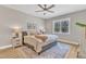 Comfortable bedroom with a ceiling fan, a patterned rug, and plenty of natural light at 9342 Turkey Way, Middlesex, NC 27557