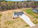 New construction boasts a charming facade, manicured front yard, and concrete driveway to an attached two-car garage at 9342 Turkey Way, Middlesex, NC 27557