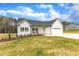 Charming new construction features a welcoming porch, attached two-car garage, and beautifully landscaped yard at 9342 Turkey Way, Middlesex, NC 27557